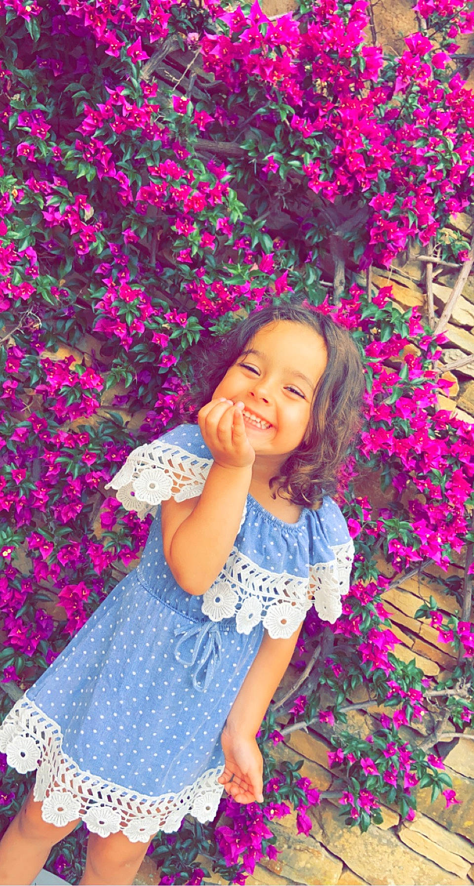 Mia participe au concours pour gagner de l'argent avec cette photo : baby_toddler_clothing, dress, eye, facial_expression, flash_photography, flower, grass, hairstyle, happy, headwear, joy, people_in_nature, person, petal, photograph, pink, plant, purple, skin, sleeve