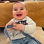Marius participe au concours pour gagner de l'argent avec cette photo : baby, child, smiling, laughing, indoor, couch, pillow, blanket, dog, pet, jeans, sweater, hands, eyes, teeth, scarf, sitting, floor, window, home