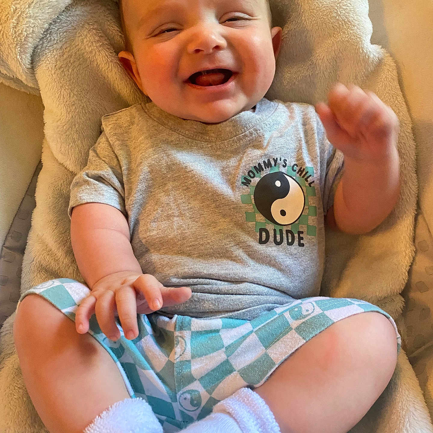 Theo joined the competition — help win amazing prizes! baby, babylaughing, clothing, couch, cushion, face, furniture, happy, head, homedecor, laughing, newborn, pants, person, photography, portrait, shorts, sitting, smile, t_shirt