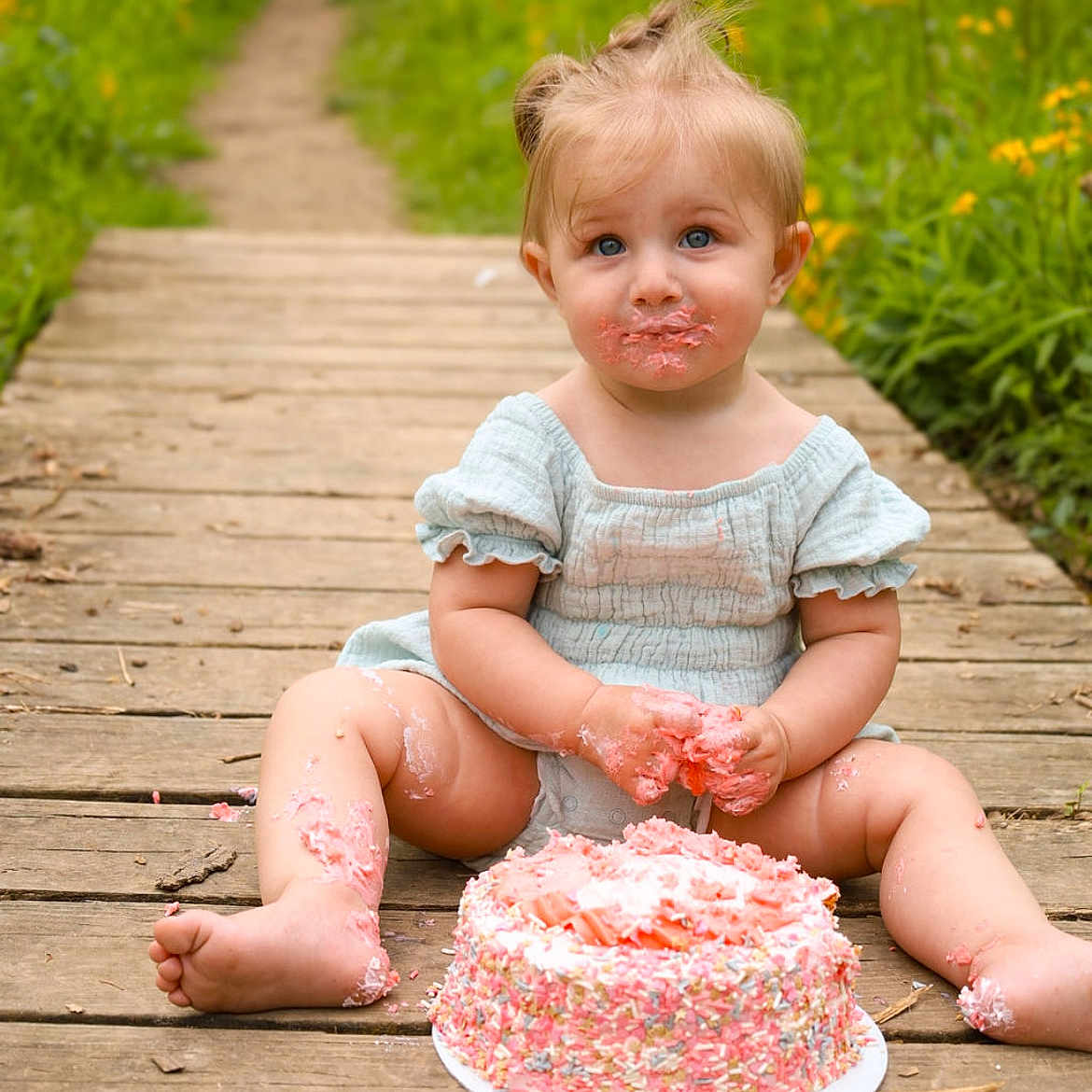 Montana Rein joined the competition — help win amazing prizes! baby, birthdaycake, cake, cream, dessert, face, flower, food, grass, head, icing, path, people, person, petal, photography, plant, portrait, sitting, water