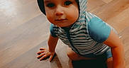 Jaxson joined the competition — help win amazing prizes! baby, casual, child, clothing, costume, crawling, curious, cute, face, floor, foot, hand, headwear, hoodie, indoor, person, striped_clothing, toddler, toy, wooden_floor