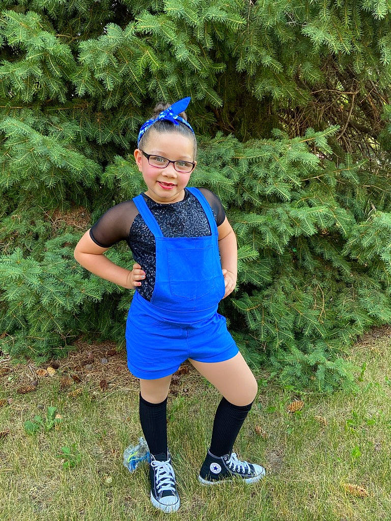 M'Alliyah is registered to the contest to win money with this photo: arm, blue, cobalt_blue, costume, electric_blue, footwear, grass, green, headgear, joint, joy, leg, leisure, person, personal_protective_equipment, photography, plant, recreation, shoe, smile