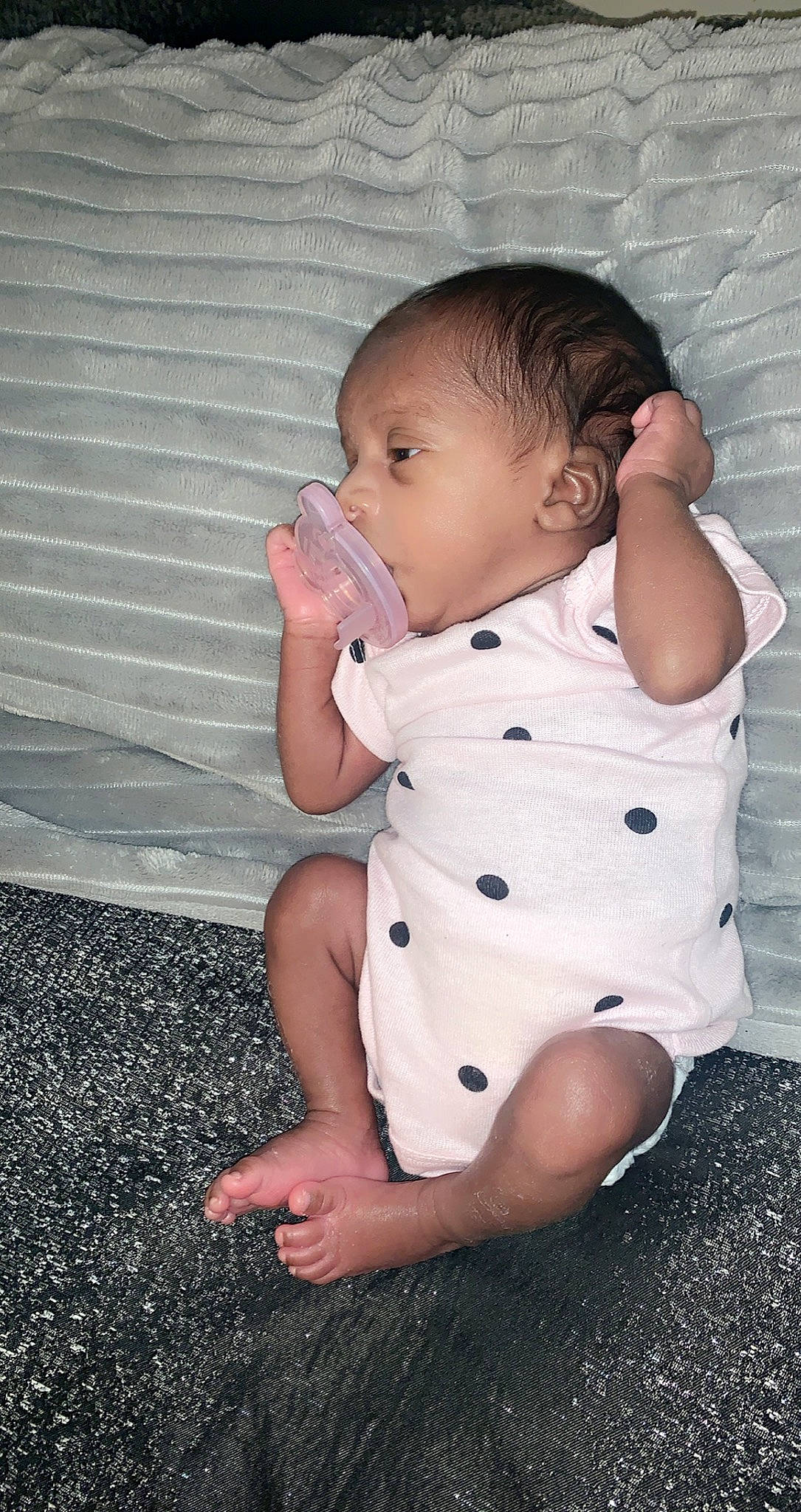 Kori is registered to the contest to win money with this photo: abdomen, arm, baby, baby_toddler_clothing, cheek, child, eye, finger, leg, neck, person, sitting, skin, toddler, trunk