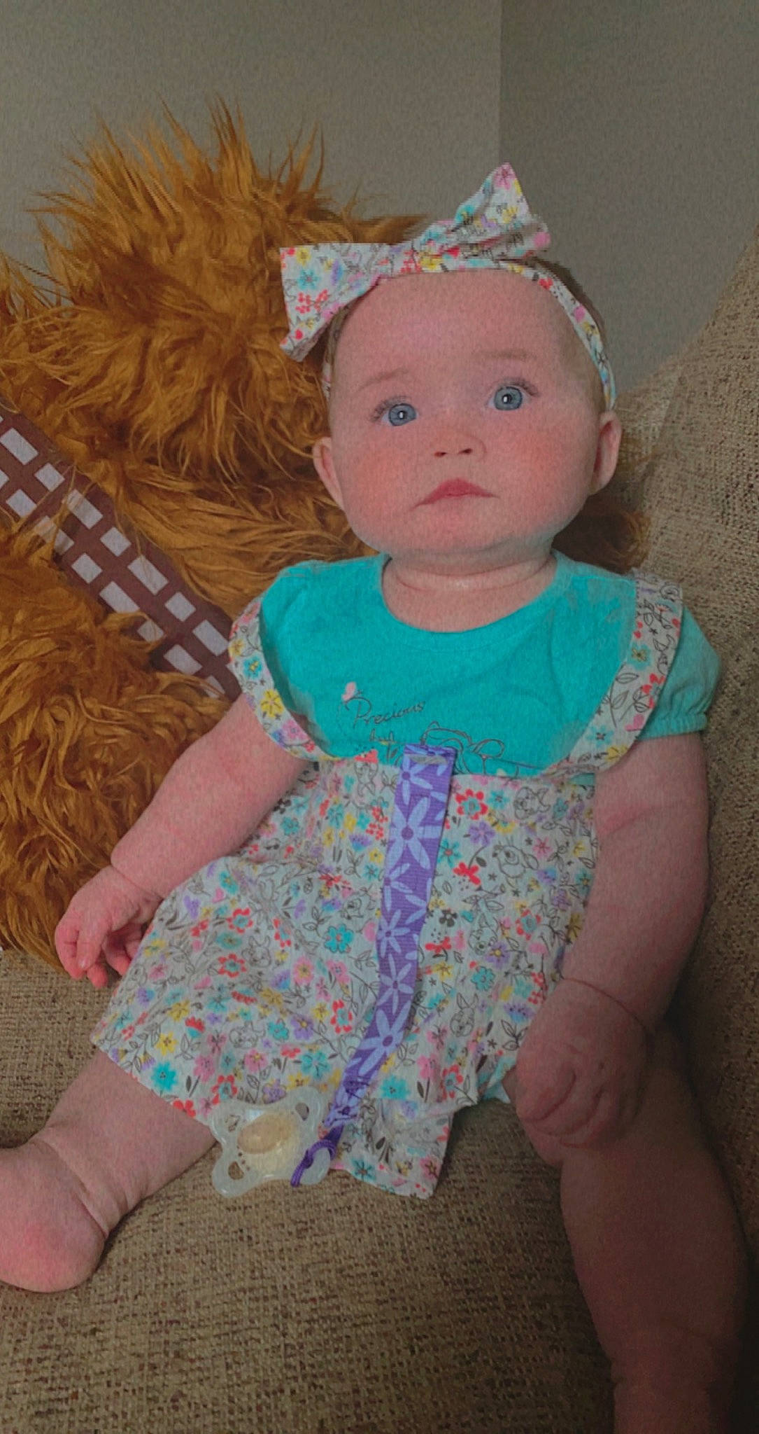 Genevieve is registered to the contest to win money with this photo: baby, baby_toddler_clothing, brown_hair, cheek, child, day_dress, dress, eye, fun, grass, headband, headgear, iris, lip, pattern, person, pink, skin, sleeve, textile