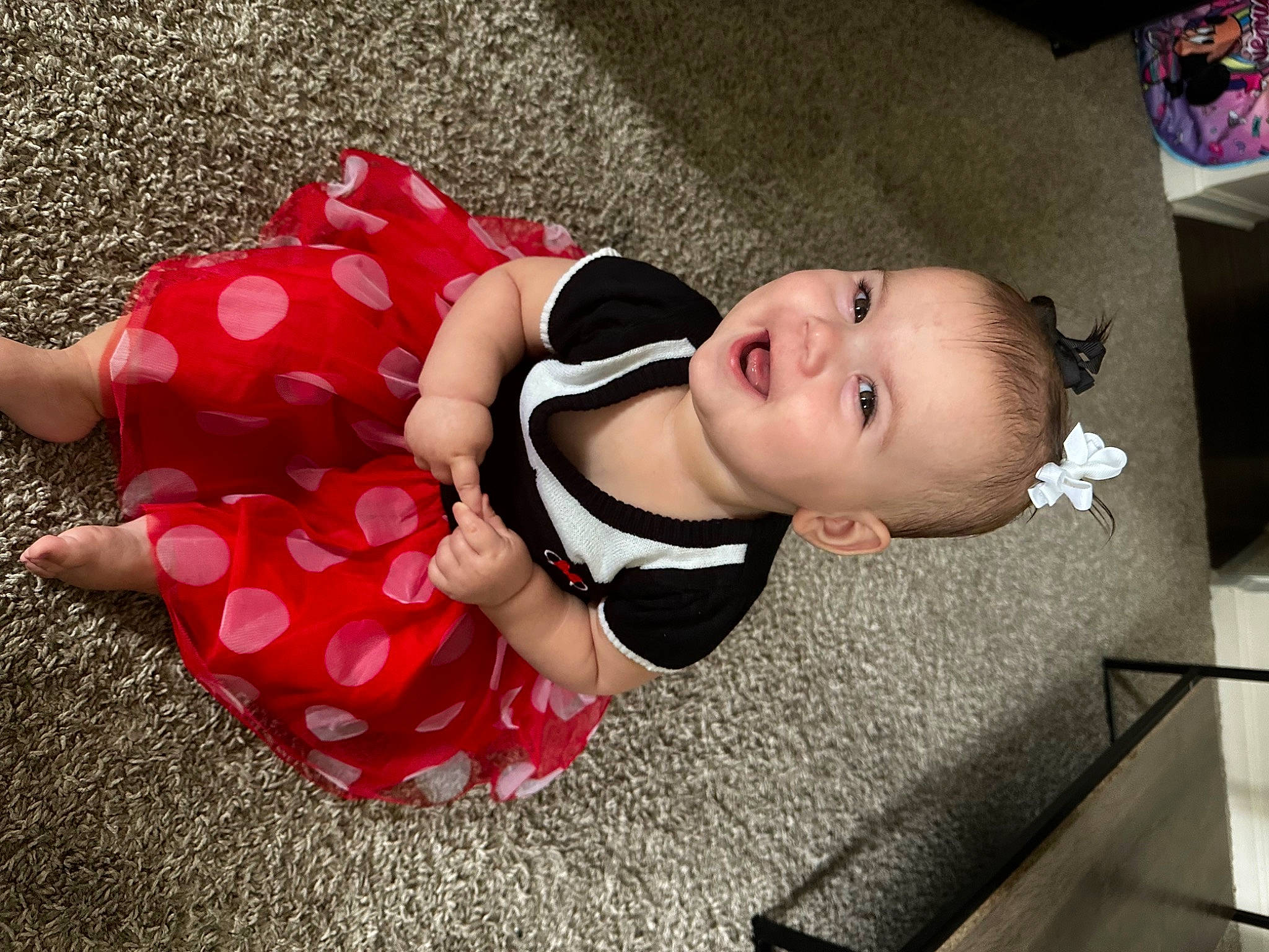 Olivia joined the competition — help win amazing prizes! baby, baby_toddler_clothing, carmine, child, comfort, flooring, fun, happy, headgear, human_leg, joy, leg, mammal, pattern, person, pink, skin, sleeve, smile, thigh