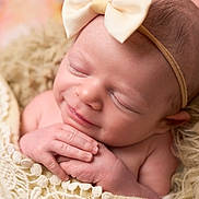 Sophia joined the competition — help win amazing prizes! newborn, baby, infant, sleeping, smiling, portrait, close_up, face, headband, bow, hands, blanket, knitted_blanket, teddy_bear, soft, cozy, pink, indoor, photography, cute
