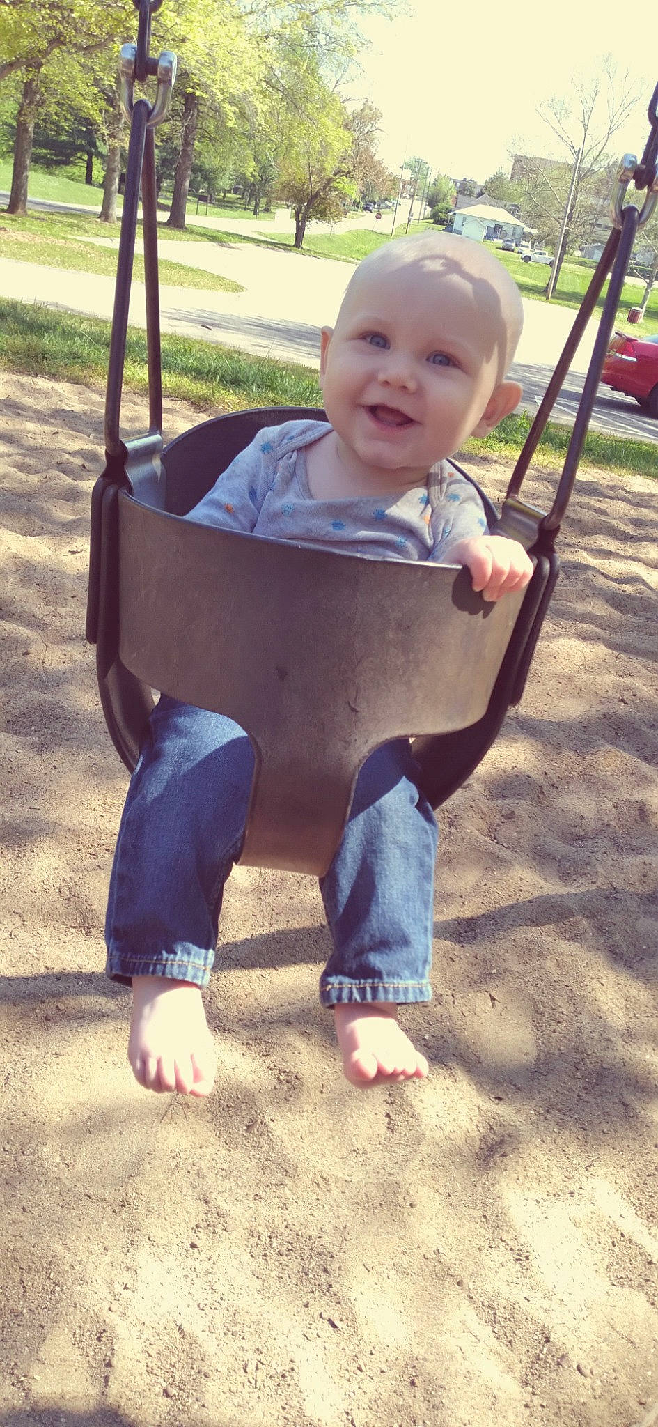 Jackie is registered to the contest to win money with this photo: baby, baby_toddler_clothing, barefoot, child, facial_expression, fun, grass, happy, joy, leisure, person, photograph, recreation, shade, sleeve, smile, snapshot, swing, tire, toddler