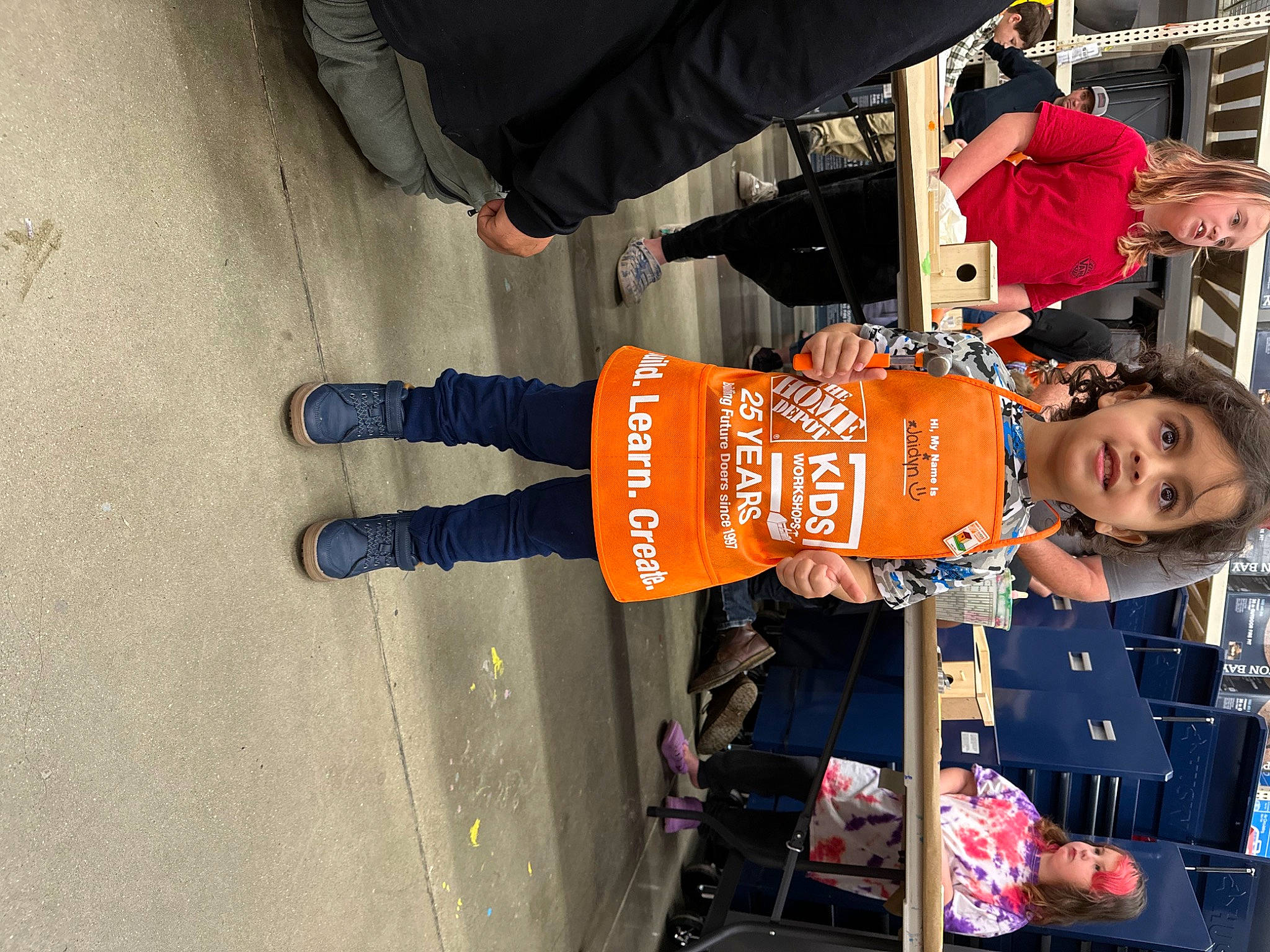 Jaidyn is registered to the contest to win money with this photo: bag, child, fun, headwear, human_leg, joy, luggage_and_bags, outdoor_shoe, pedestrian, person, sleeve, smile, tire, toddler, travel, walking_shoe