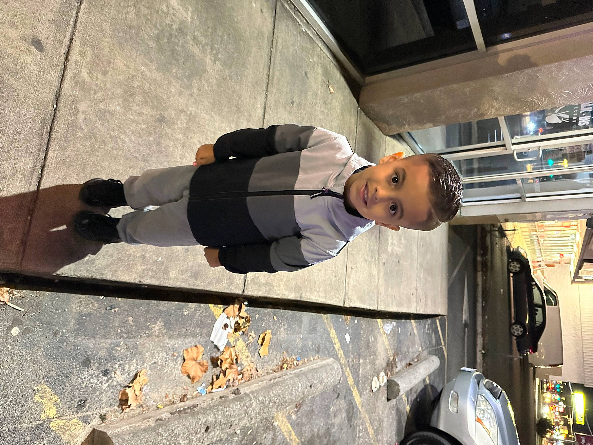 Jaidyn is registered to the contest to win money with this photo: asphalt, auto_part, automotive_design, automotive_exterior, automotive_lighting, car, concrete, hat, human_leg, joy, pedestrian, person, road, road_surface, shadow, sidewalk, street, tire, travel, vehicle_door