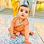 baby, child, crawling, floor, curious_eyes, peach_clothing, bracelet, indoors, blurred_background, person, cute, young_child, portrait, skin, hands, feet, jewelry, bright, daylight, expression