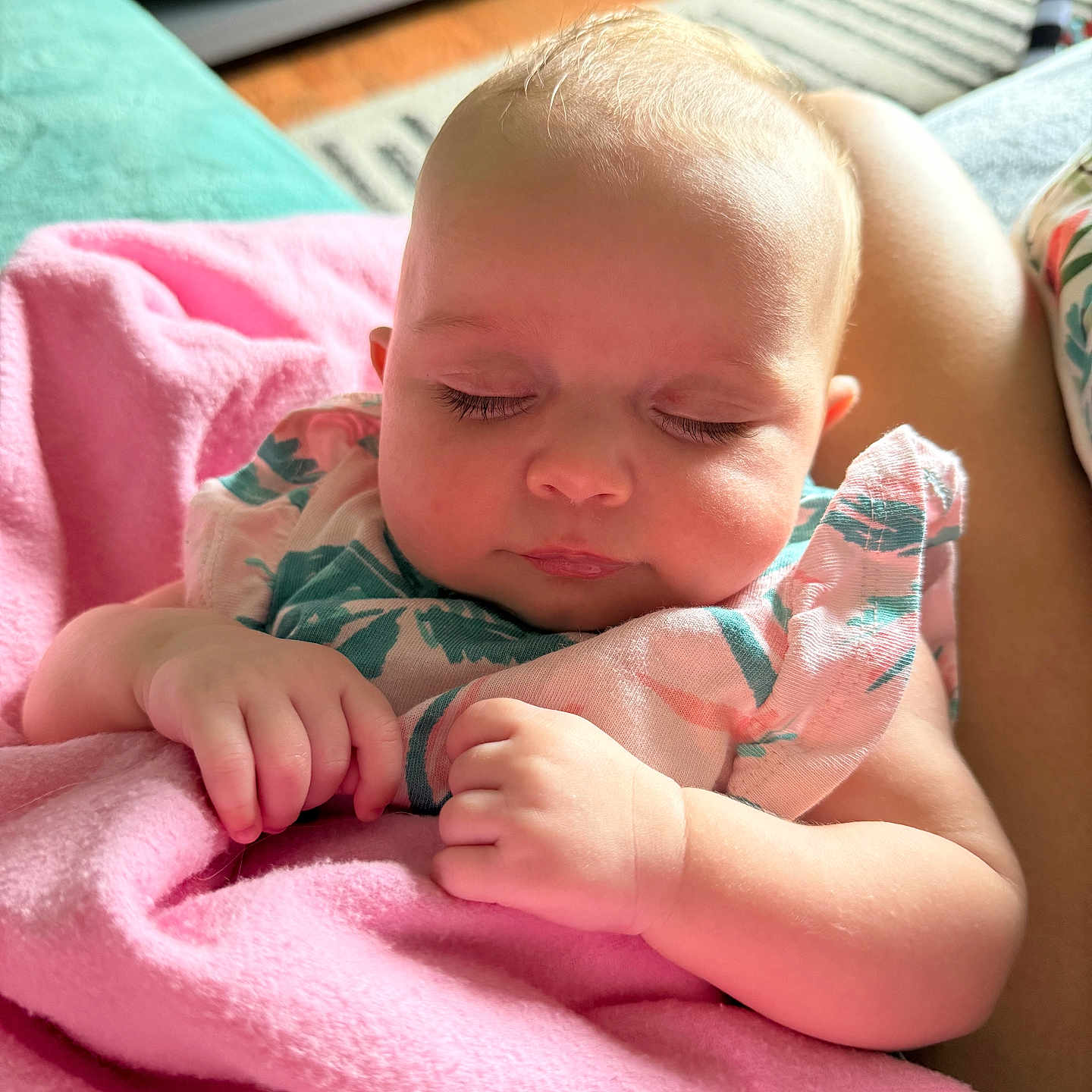 Emery is registered to the contest to win money with this photo: baby, blanket, child, closed_eyes, clothing, comfort, couch, cozy, cute, face, hands, home_interior, infant, peaceful, person, pink, portrait, resting, sleeping, soft_light