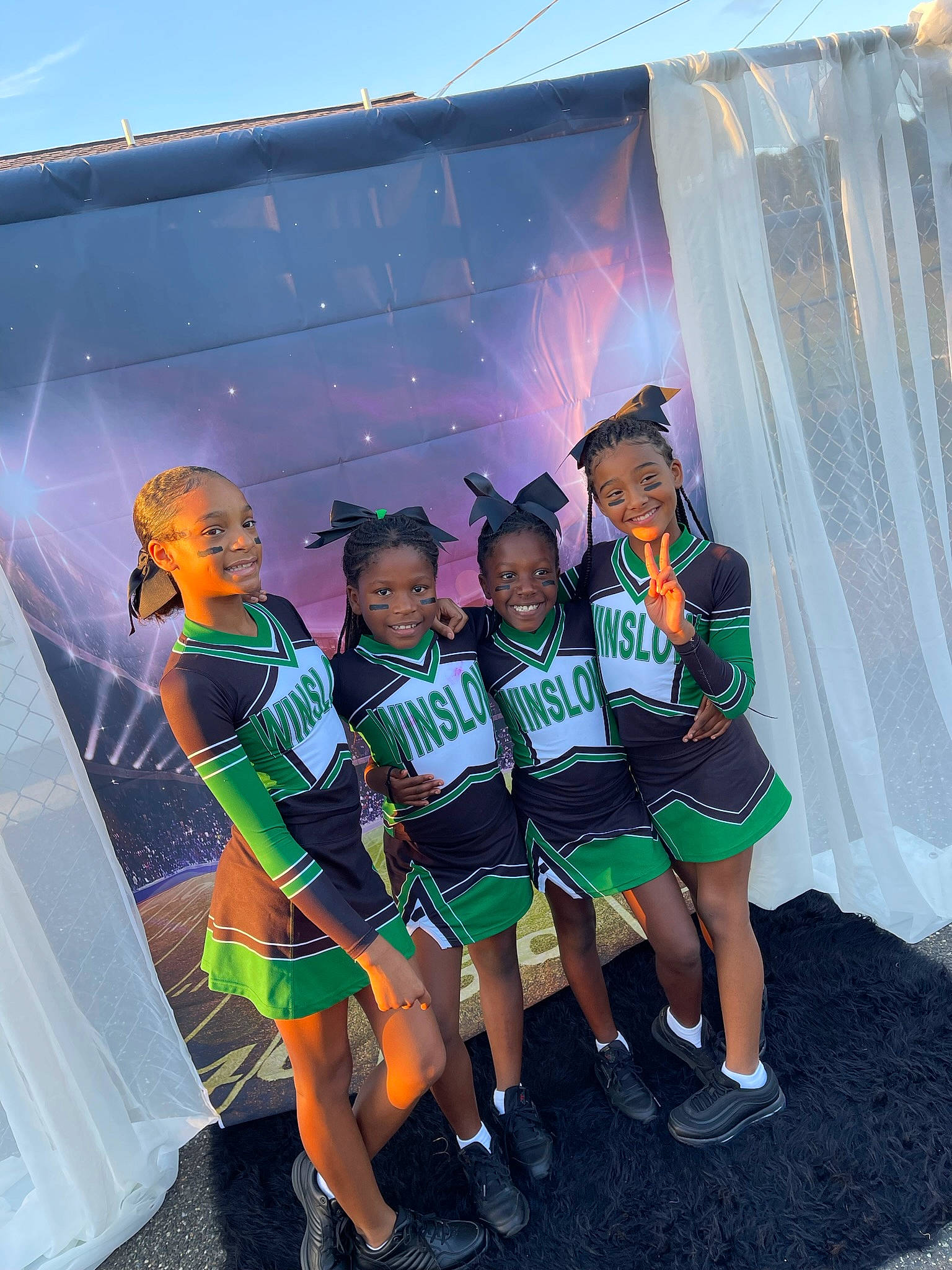 Unique is registered to the contest to win money with this photo: automotive_design, boot, costume, electric_blue, entertainment, event, fashion_design, fun, human_leg, joy, leisure, luxury_vehicle, person, public_event, recreation, sandal, shoe, shorts, smile, sneakers