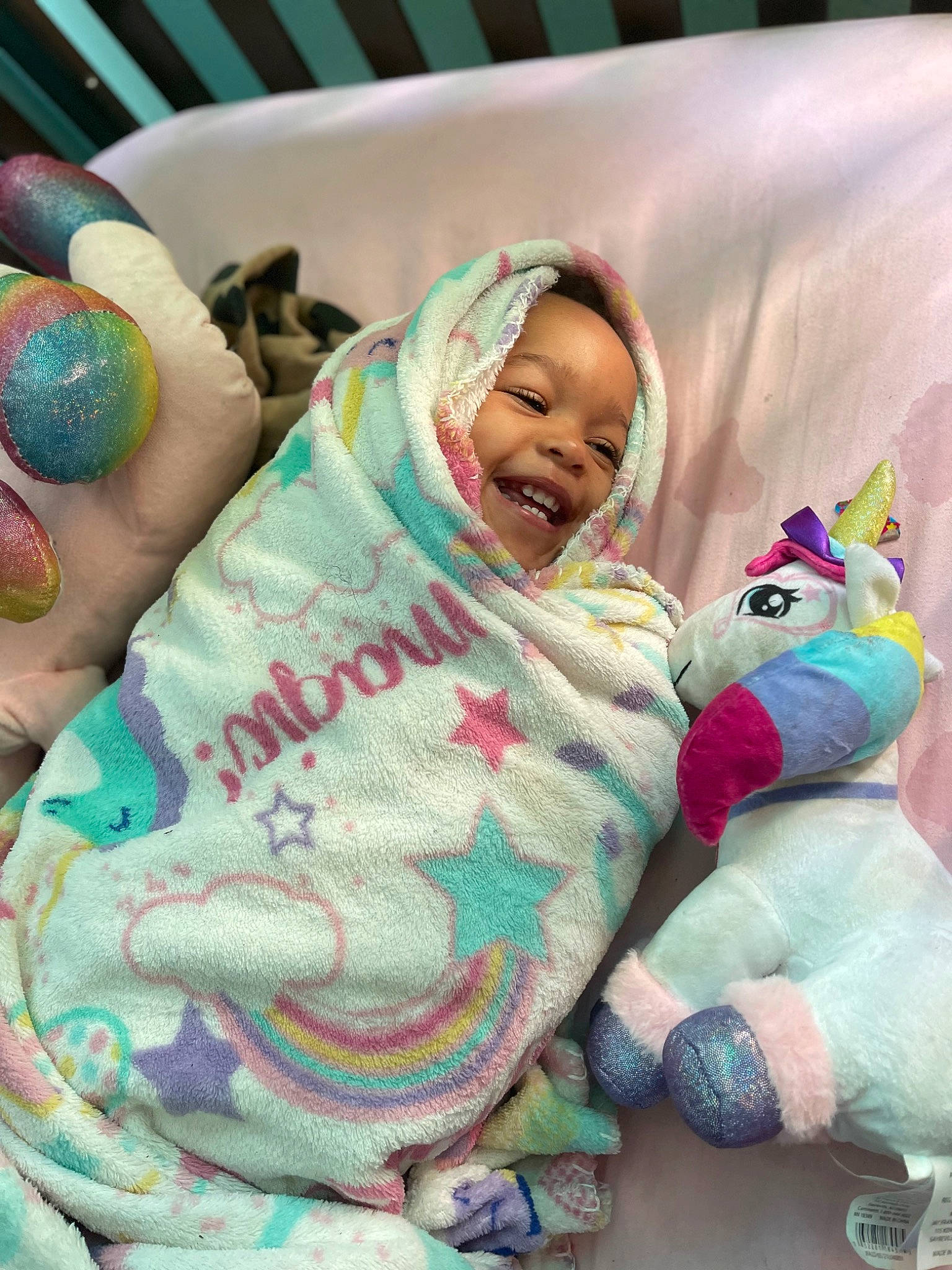 Miracle is registered to the contest to win money with this photo: baby, baby_products, baby_toddler_clothing, child, comfort, fun, green, happy, leisure, linens, magenta, mammal, person, pink, product, sitting, skin, smile, textile, toddler