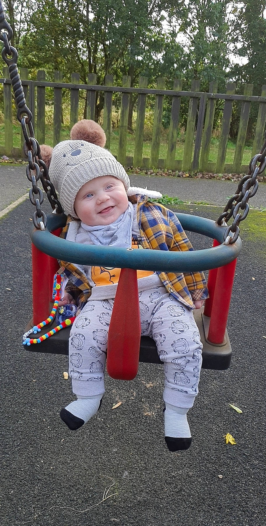 Caleb joined the competition — help win amazing prizes! baby, baby_products, baby_toddler_clothing, child, city, costume, fence, fun, grass, happy, headwear, joy, leisure, outdoor_play_equipment, person, play, playground, recreation, sitting, smile