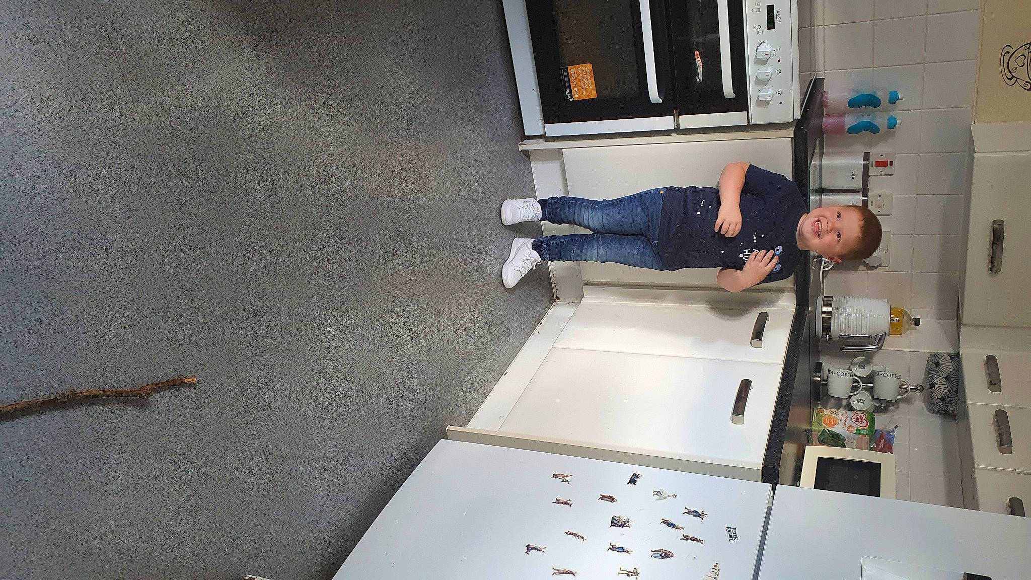 Tommie is registered to the contest to win money with this photo: automotive_design, building, ceiling, elbow, employment, engineering, fashion_design, flooring, job, joy, machine, person, room, service, shelf, smile, t_shirt, white, wrist