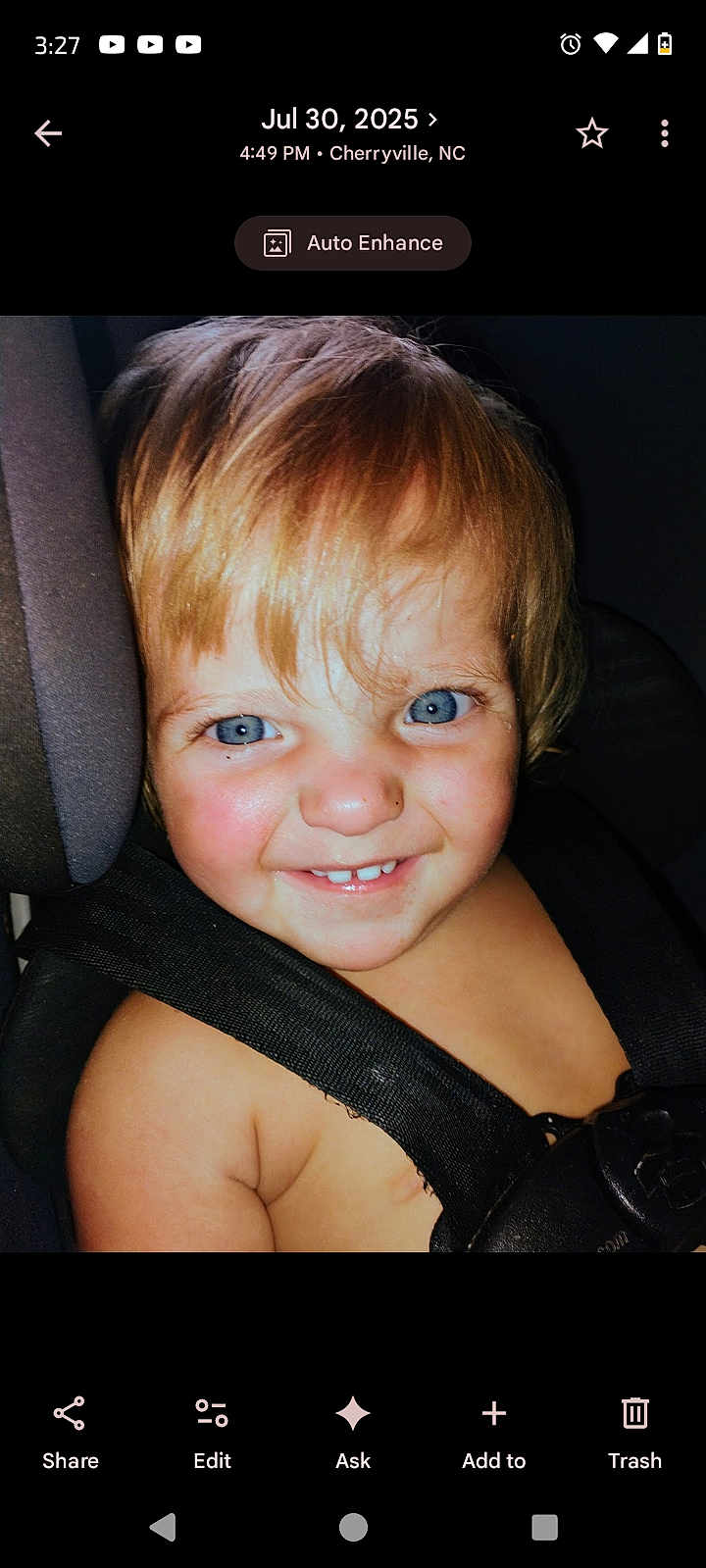 Colt is registered to the contest to win money with this photo: child, toddler, blue_eyes, blond_hair, smile, gap_tooth, car_seat, seat_belt, close_up, portrait, flash, rosy_cheeks, happy, indoors, baby_skin, head, hair, snapshot, phone_ui, timestamp