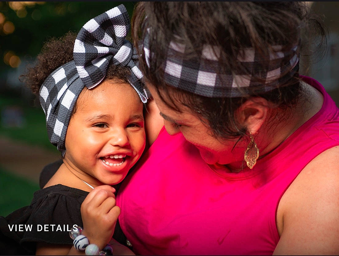 Lina is registered to the contest to win money with this photo: child, fun, hair_accessory, happy, headband, headgear, headwear, hug, interaction, love, person, photography, smile, toddler