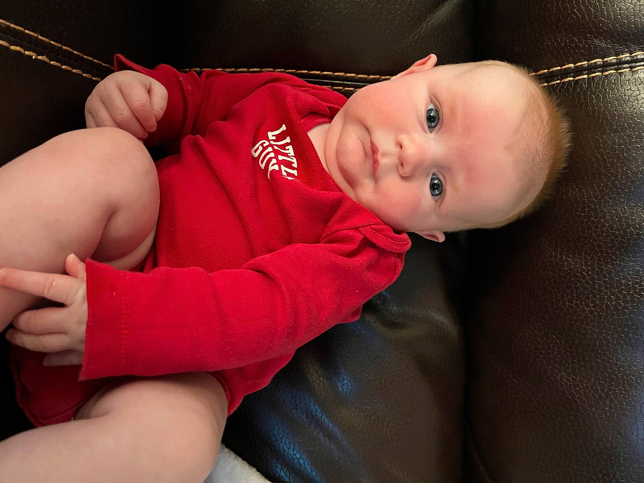 Knox is registered to the contest to win money with this photo: baby, baby_toddler_clothing, cheek, chest, child, comfort, elbow, eye, flash_photography, gesture, human_body, knee, leg, mouth, nose, person, skin, sleeve, smile, thigh