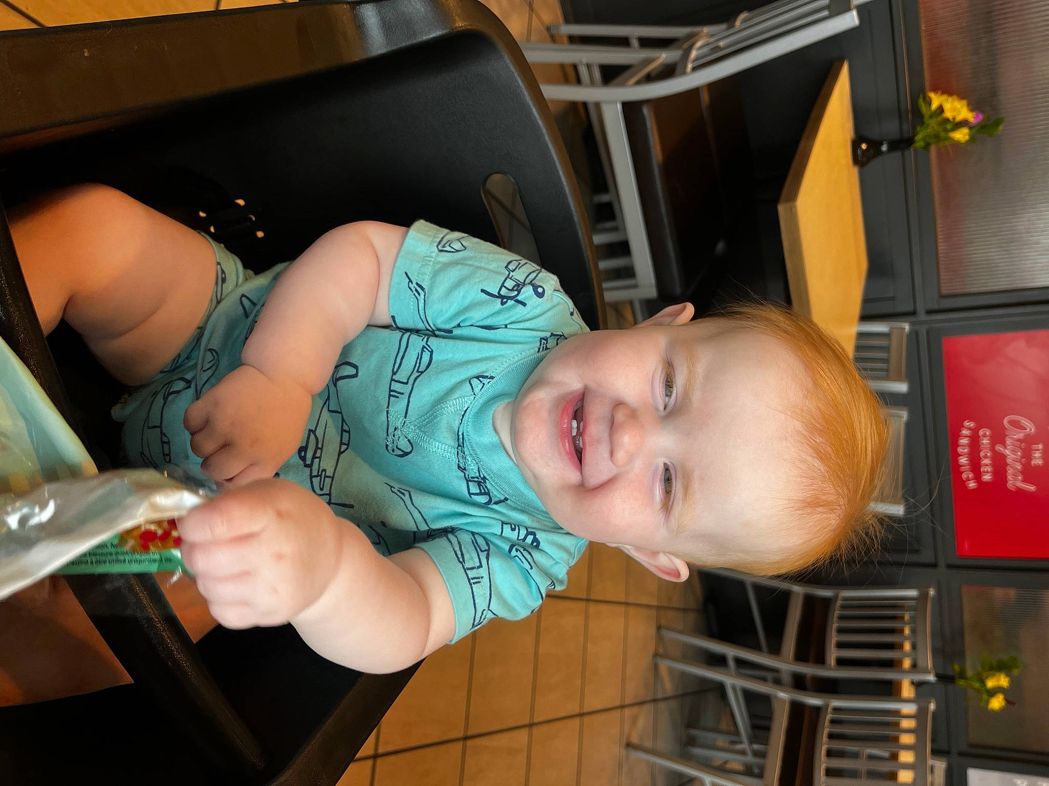 Knox is registered to the contest to win money with this photo: baby, baby_products, baby_toddler_clothing, cheek, child, dress, fun, happy, human_leg, joy, mouth, nail, person, room, sitting, skin, smile, thumb, toddler, vacation