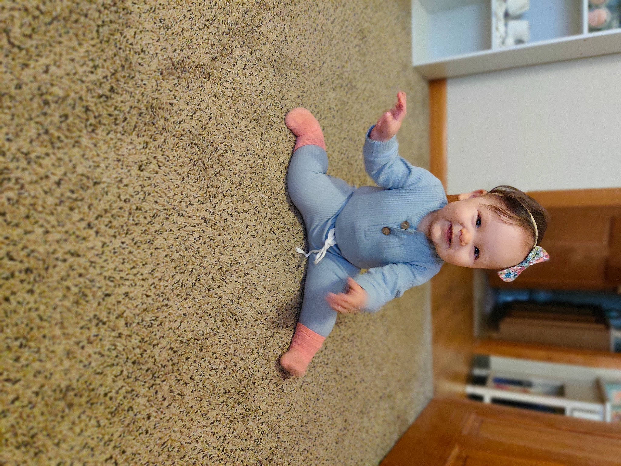 Aviana is registered to the contest to win money with this photo: baby, barefoot, ceiling, comfort, elbow, flooring, foot, fun, gesture, happy, hardwood, home_appliance, leisure, person, sitting, t_shirt, television, toddler, tree, wood