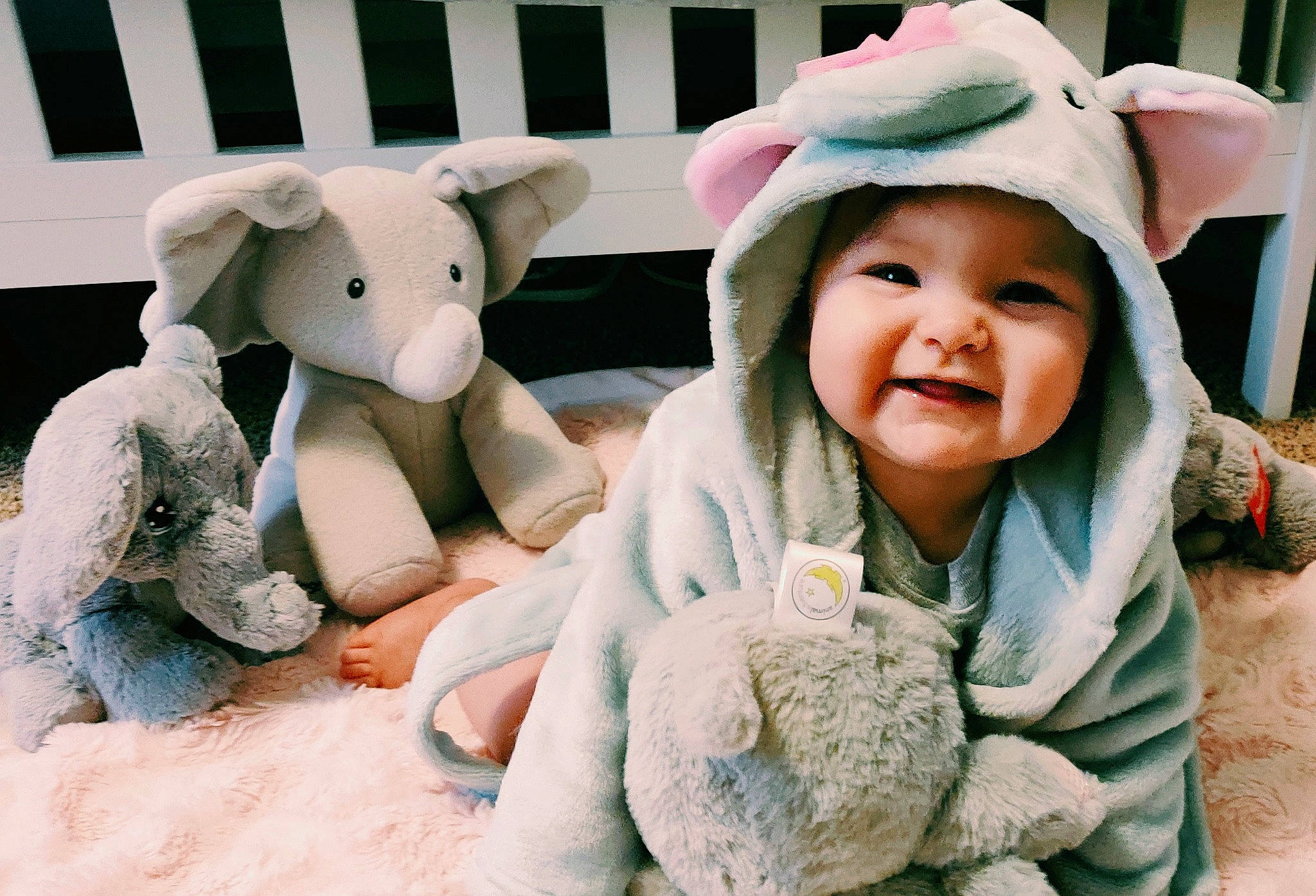 Aviana is registered to the contest to win money with this photo: baby, baby_toddler_clothing, cap, child, costume_hat, ear, fashion_accessory, fun, happy, headgear, headwear, jacket, joy, nose, person, pink, skin, smile, sun_hat, textile