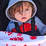 Silas joined the competition — help win amazing prizes! toddler, child, hoodie, blanket, snowflake_pattern, stroller, face, hair, clothing, red, grey, black, baby, outdoor, winter, bundle, cute, young_child, portrait, seatbelt