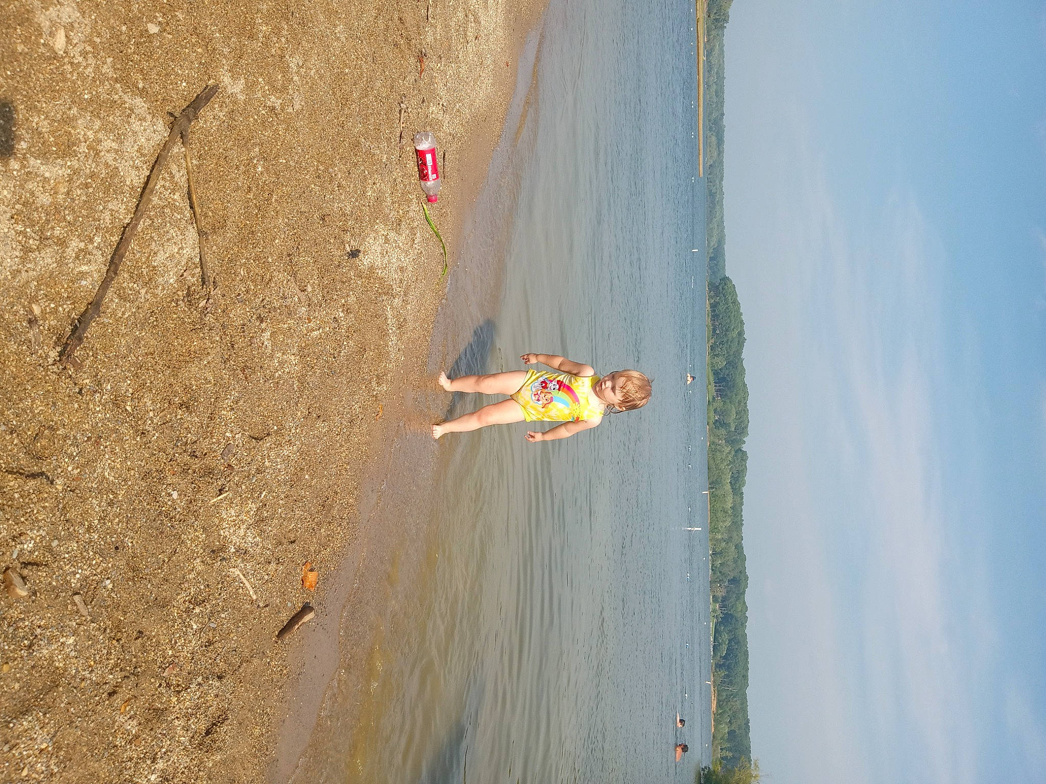 Jamie is registered to the contest to win money with this photo: adventure, beach, cloud, coast, extreme_sport, fun, horizon, lake, landscape, leg, leisure, person, plant, recreation, shadow, shore, sky, slope, tree, water