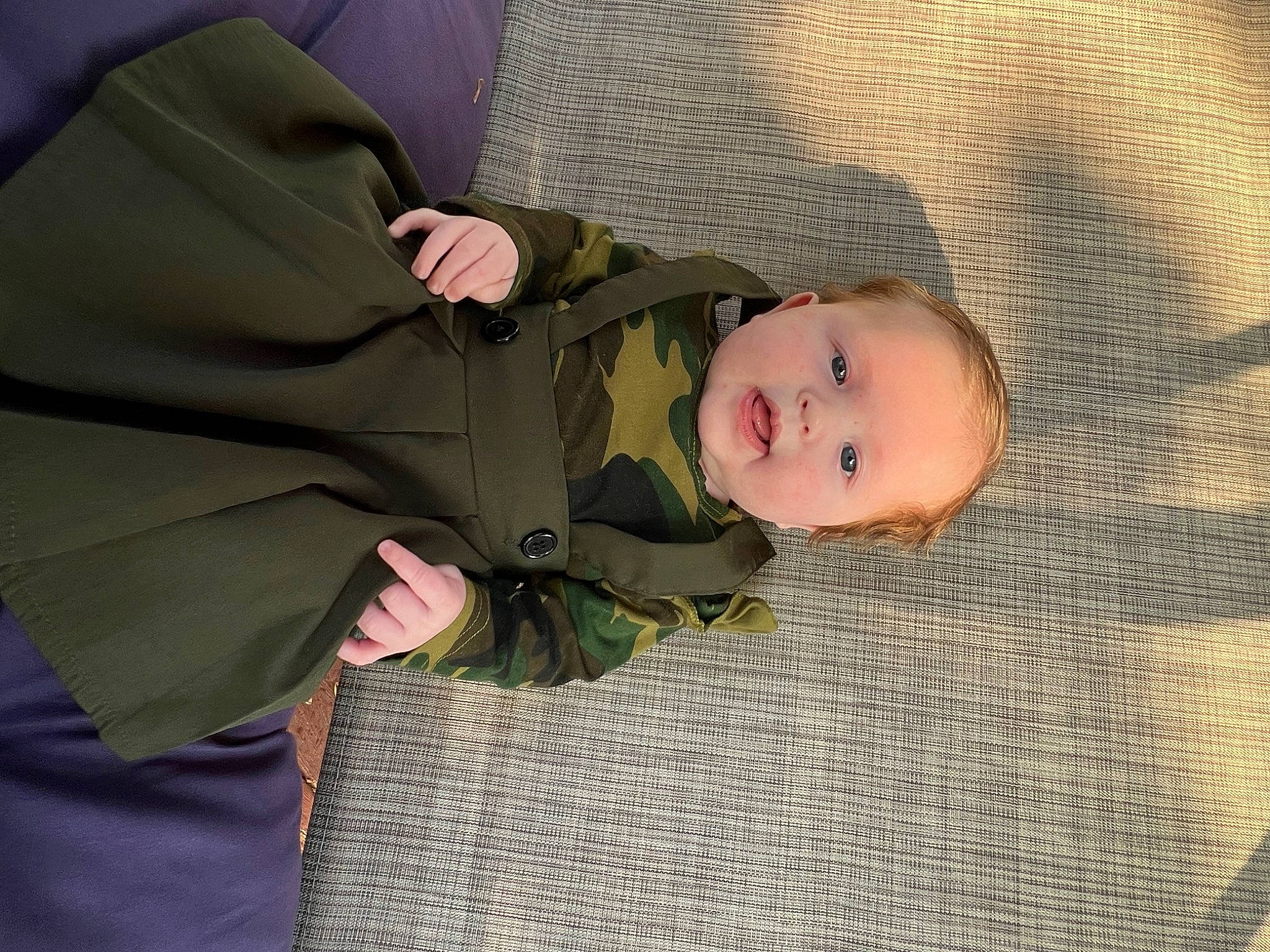 Reese joined the competition — help win amazing prizes! baby, baby_products, baby_toddler_clothing, camouflage, cheek, child, comfort, face, flooring, fun, gesture, head, linens, military_camouflage, pattern, person, skin, sleep, sleeve, toddler
