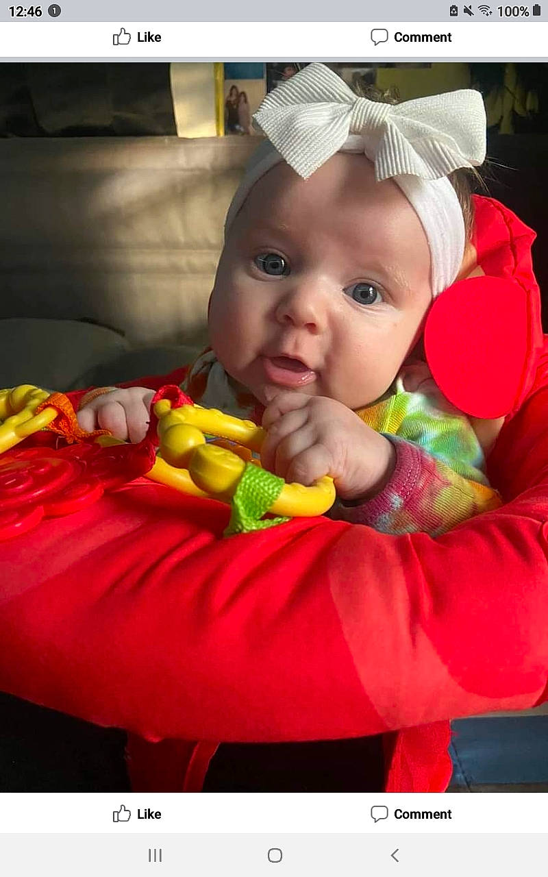 Luna Grace is registered to the contest to win money with this photo: baby, baby_products, baby_toddler_clothing, cap, child, fictional_character, fun, happy, headwear, iris, linens, person, petal, photo_caption, photography, play, portrait_photography, room, sitting, snapshot