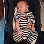 Maelle a rejoint le concours — aidez-le/la à gagner de superbes lots ! baby, black_and_white, casual, child, cozy, cushion, cute, footwear, indoor, infant, mickey_mouse, peaceful, person, portrait, relaxing, sleeping, soft_lighting, striped_clothing, stroller, toddler