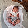 émiliana a rejoint le concours — aidez-le/la à gagner de superbes lots ! baby, newborn, sleeping, baby_rocker, onesie, unicorn, infant, indoor, floor_tiles, wooden_cabinet, peaceful, child, person, cute, soft_colors, home, furniture, resting, toddler, baby_seat