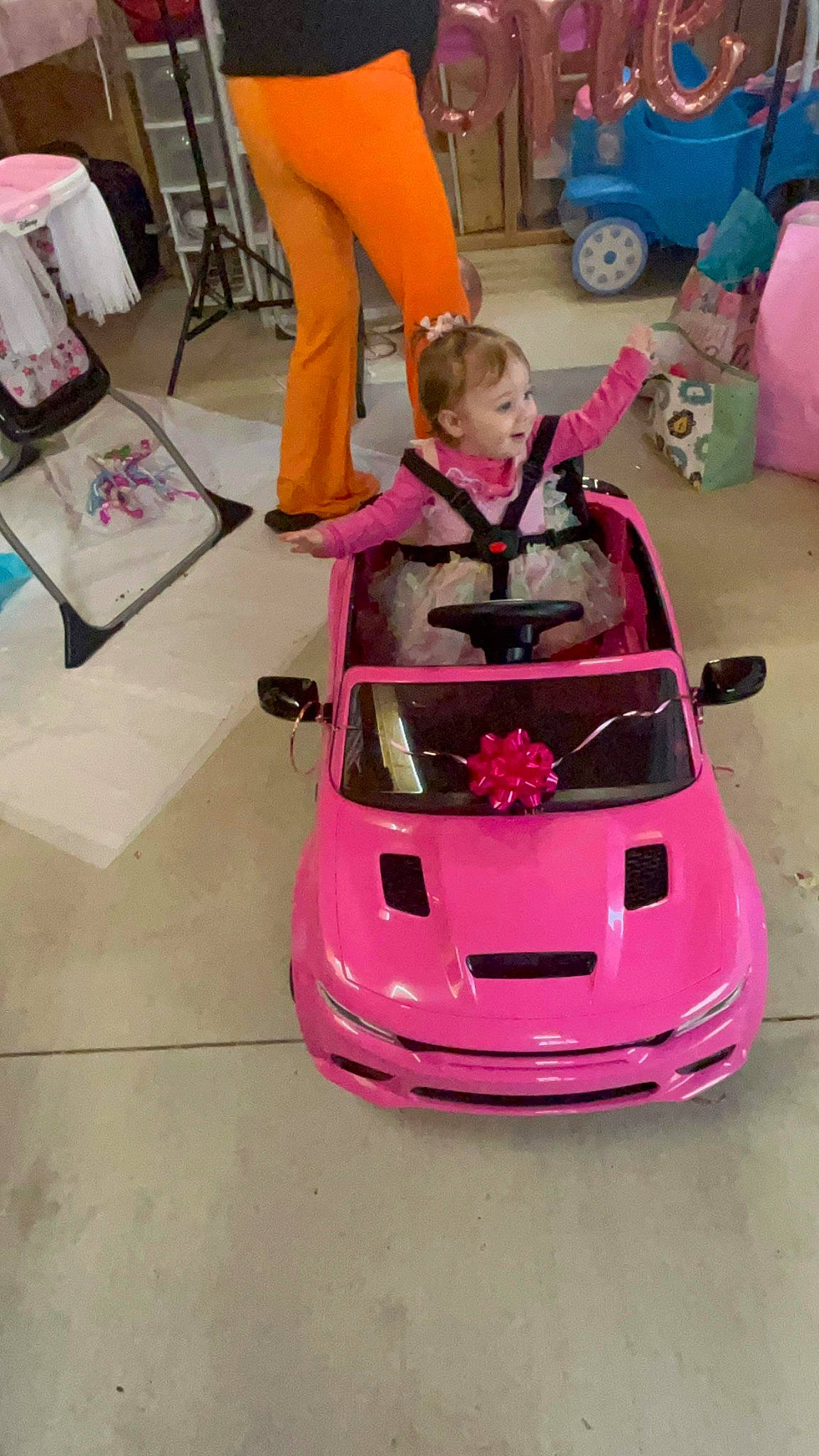 Nelly joined the competition — help win amazing prizes! auto_part, automotive_design, automotive_exterior, automotive_lighting, automotive_wheel_system, bumper, car, chair, hood, luxury_vehicle, motor_vehicle, performance_car, person, personal_luxury_car, pink, smile, tire, toddler, vehicle, vehicle_door