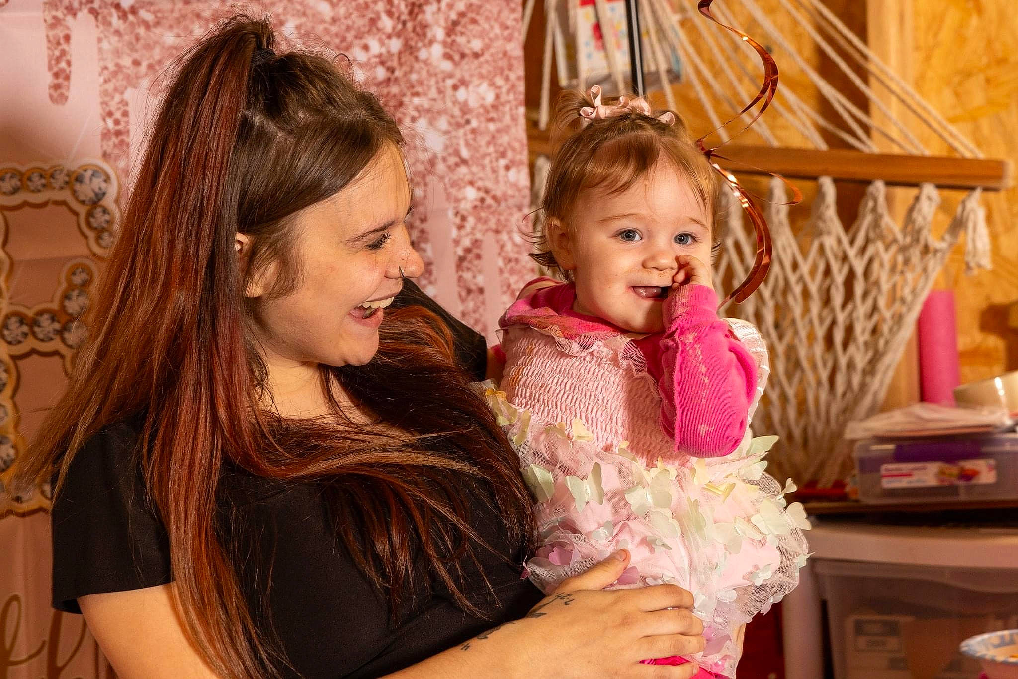 Nelly is registered to the contest to win money with this photo: beauty, blond, child, event, facial_expression, fun, happy, iris, jewellery, joy, laugh, layered_hair, leisure, magenta, organ, party, person, pink, room, sitting