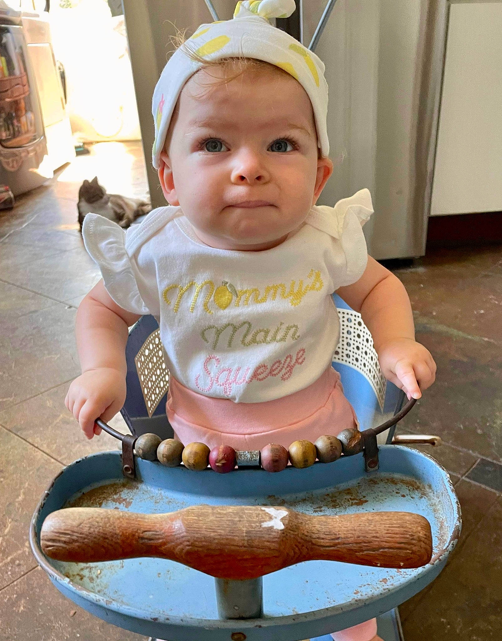 Charlotte is registered to the contest to win money with this photo: baby, baby_carriage, baby_products, baby_safety, baby_toddler_clothing, chair, cheek, child, face, fashion_accessory, happy, head, headband, organ, person, photograph, sitting, skin, sleeve, snapshot