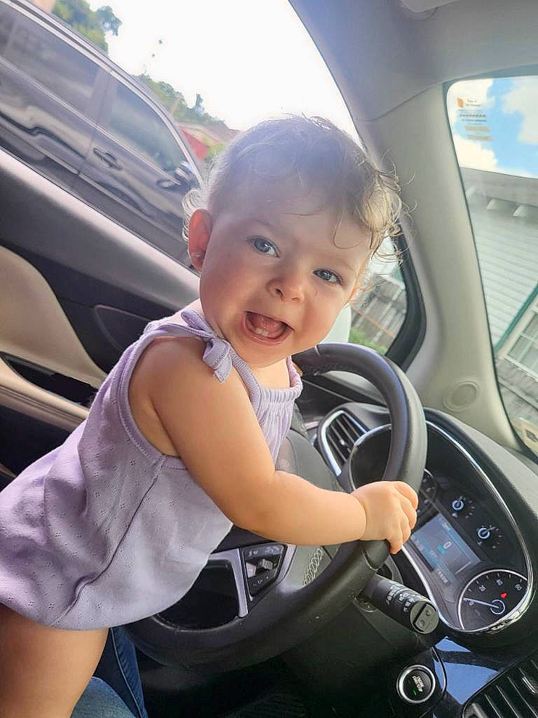 Charlotte joined the competition — help win amazing prizes! auto_part, automotive_design, automotive_exterior, automotive_mirror, automotive_tire, automotive_wheel_system, car, car_seat, child, mode_of_transport, motor_vehicle, person, personal_luxury_car, plant, smile, steering_part, steering_wheel, toddler, vehicle, vehicle_door