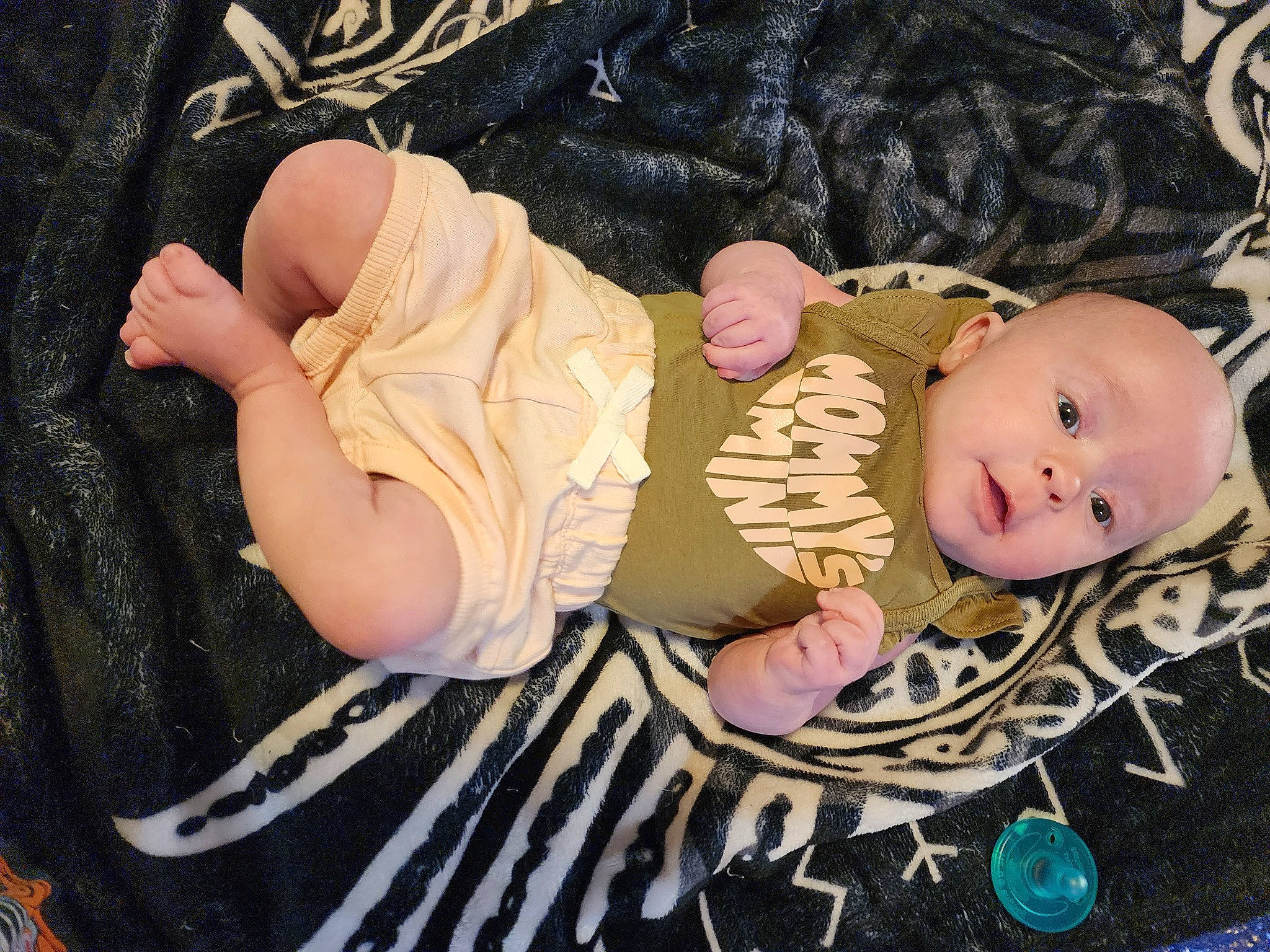 Brenn is registered to the contest to win money with this photo: baby, baby_products, baby_sleeping, baby_toddler_clothing, cheek, child, comfort, doll, eye, eyelash, fashion_accessory, head, human_body, linens, pattern, person, sitting, sleeve, toddler, toy