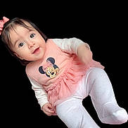 Karen joined the competition — help win amazing prizes! baby, child, infant, girl, smiling, pink_dress, minnie_mouse, bow, cute, portrait, white_tights, happy, face, long_sleeves, sitting, young_child, studio, isolated, black_background, playful