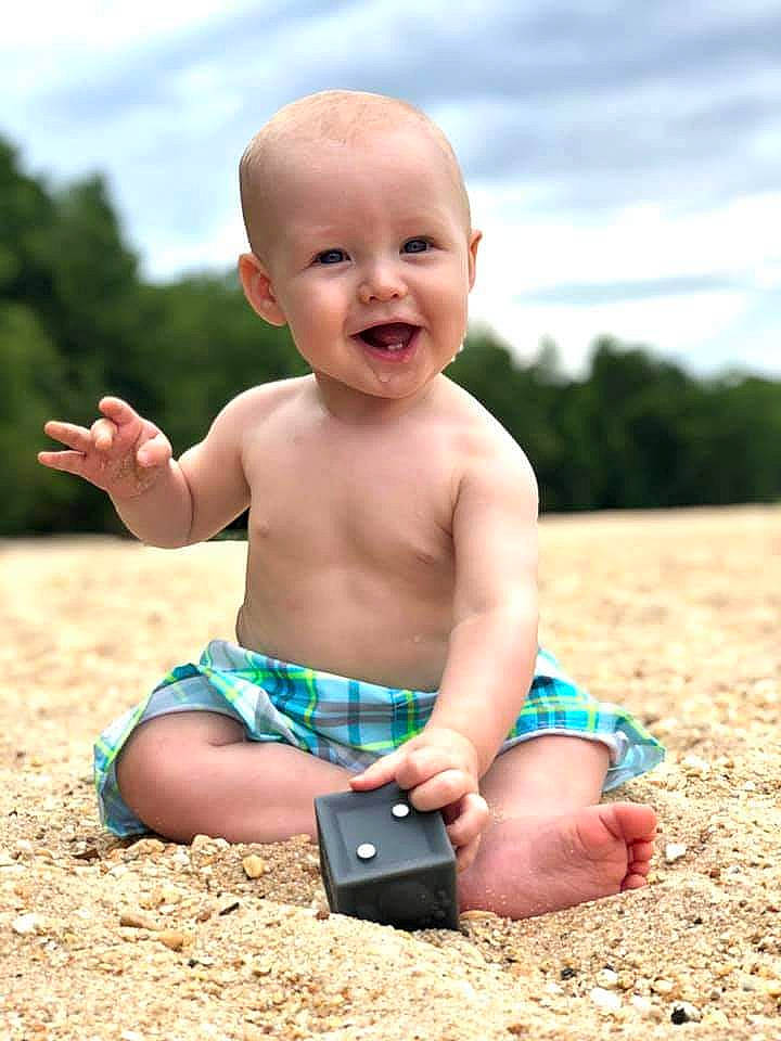 Lucas is registered to the contest to win money with this photo: baby, child, diaper, fun, joy, person, play, sand, sitting, smile, soil, summer, toddler, vacation