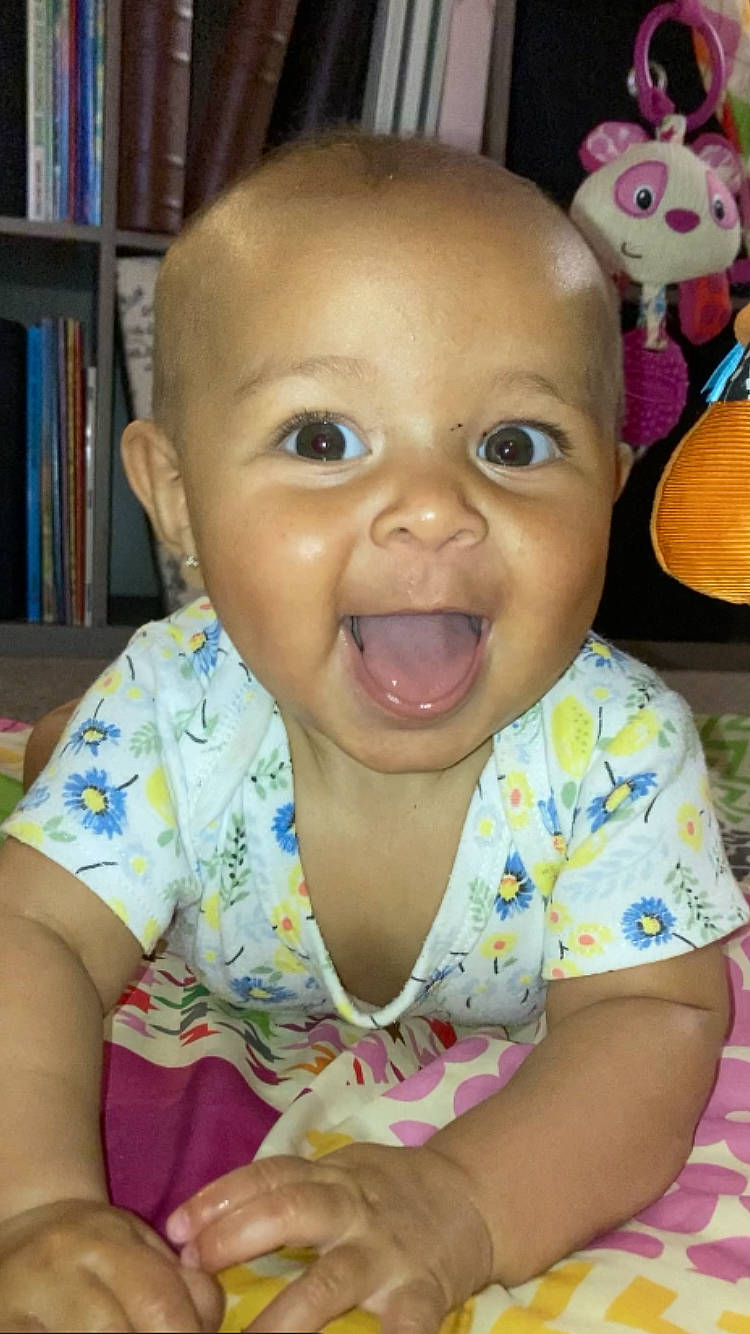 Kailynn joined the competition — help win amazing prizes! bookcase, cheek, chin, ear, eyebrow, face, facial_expression, forehead, hairstyle, happy, head, iris, lip, mouth, nose, person, pink, shelf, skin, smile