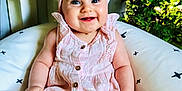 élia participe au concours pour gagner de l'argent avec cette photo : baby, child, smiling, pink_dress, headband, bow, cushion, indoor, flowers, greenery, happy, portrait, sitting, blue_eyes, cute, infant, soft_lighting, person, skin, cheerful