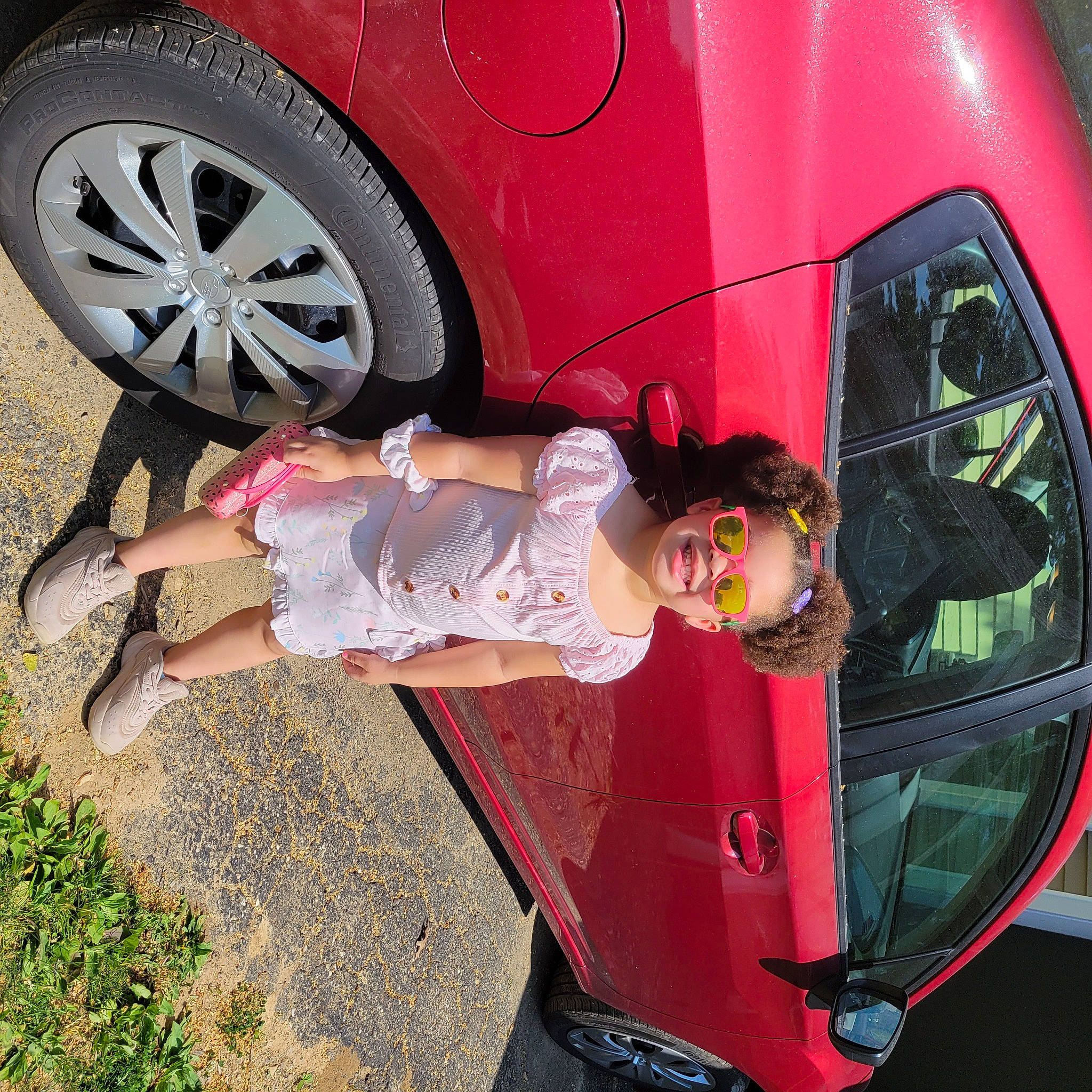 Azaria is registered to the contest to win money with this photo: alloy_wheel, automotive_design, automotive_exterior, automotive_lighting, automotive_tire, bumper, car, hood, hubcap, joy, land_vehicle, light, mode_of_transport, motor_vehicle, person, product, rim, tire, tread, vehicle