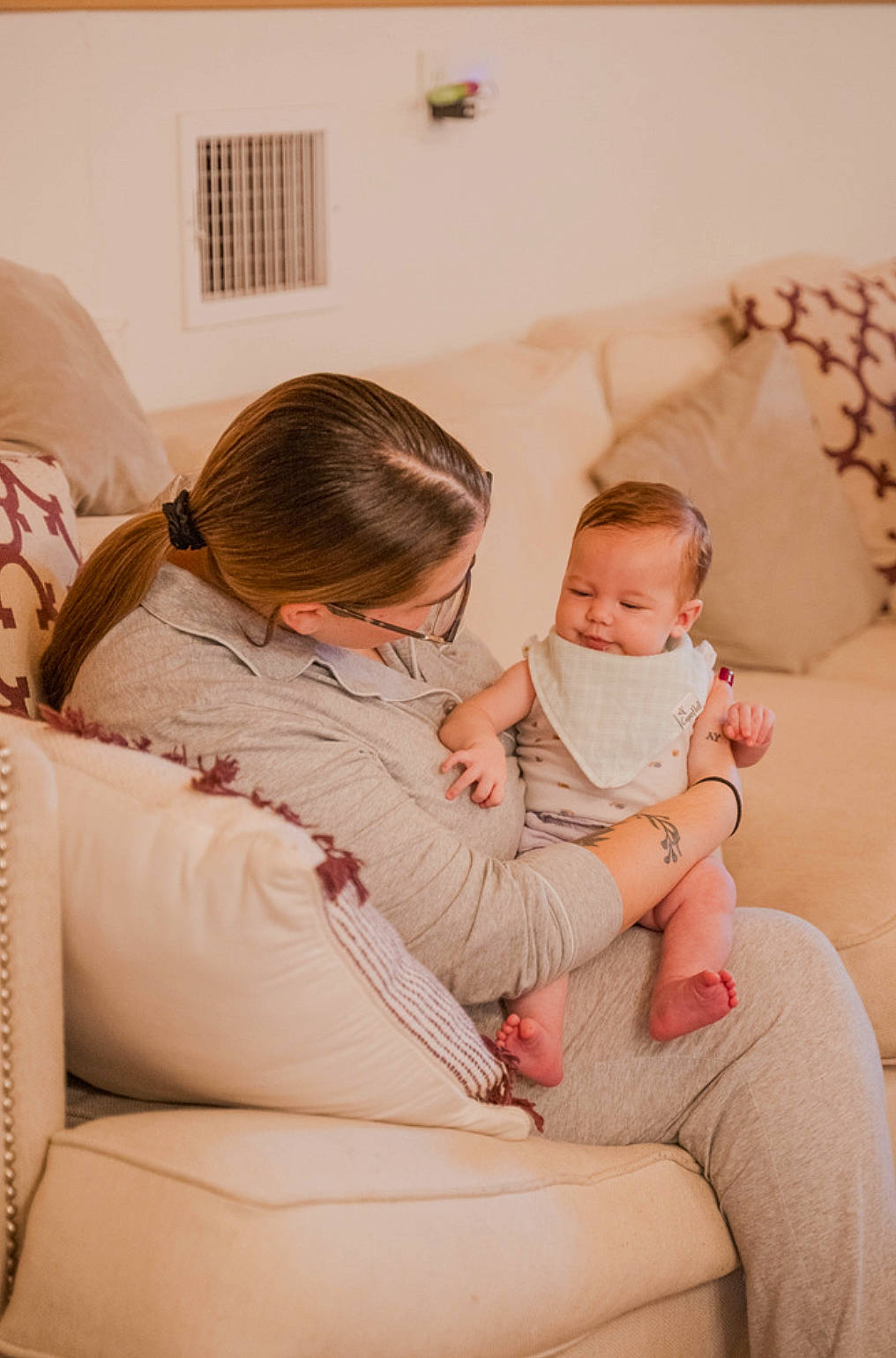 Lacie joined the competition — help win amazing prizes! baby, child, comfort, couch, fun, glasses, happy, human_body, human_leg, lap, linens, living_room, person, room, shoulder, sitting, t_shirt, thigh, toddler