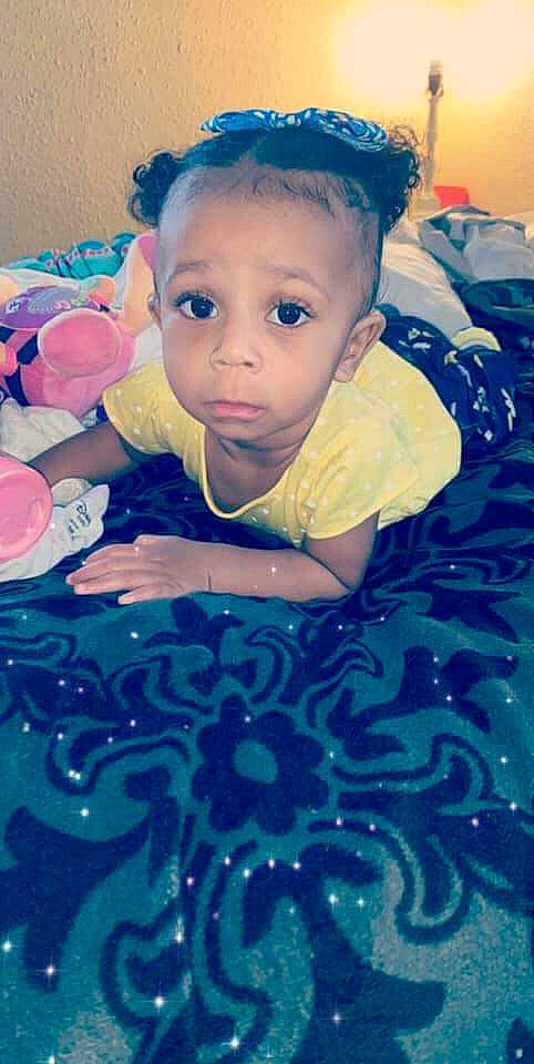 D'Ream is registered to the contest to win money with this photo: baby, blue, cheek, child, cool, eye, face, fun, happy, head, iris, nose, person, play, skin, smile, textile, toddler, tummy_time, turquoise