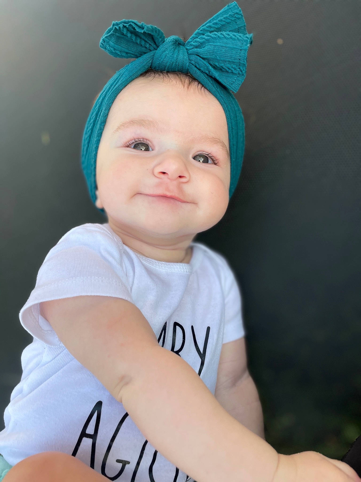 Dalia is registered to the contest to win money with this photo: baby, baby_toddler_clothing, cap, child, costume_hat, electric_blue, eye, fashion_accessory, flash_photography, happy, hat, head, headband, headpiece, knit_cap, person, sleeve, smile, t_shirt, toddler