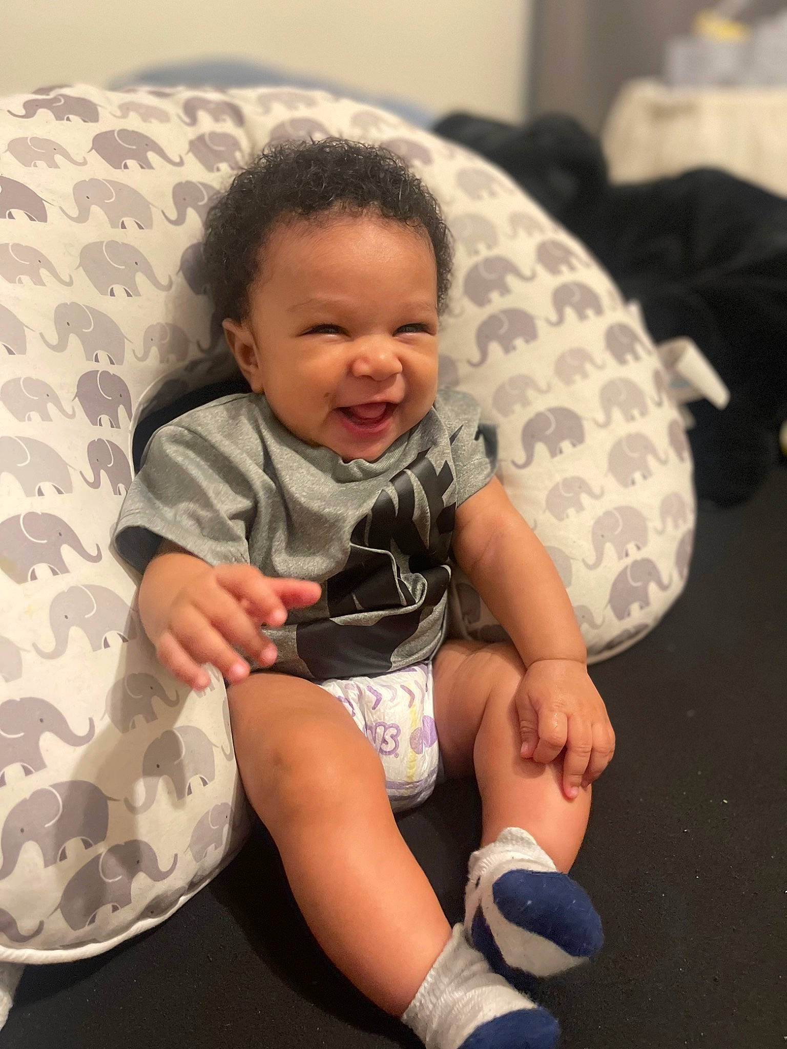 Devonte joined the competition — help win amazing prizes! baby, baby_toddler_clothing, child, comfort, face, finger, foot, fun, happy, human_leg, knee, person, sitting, skin, sleeve, smile, sneakers, sock, t_shirt, thigh
