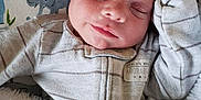 Cameron is registered to the contest to win money with this photo: baby, baby_sleeping, blanket, cheek, child, face, head, lip, mouth, nap, nose, skin, sleep, smile, toddler