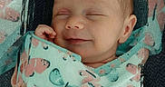 Bonnie is registered to the contest to win money with this photo: baby, sleeping, blanket, butterfly_pattern, swaddled, newborn, infant, peaceful, smile, closeup, portrait, soft_light, cozy, cute, child, wrapped, texture, fabric, head, face