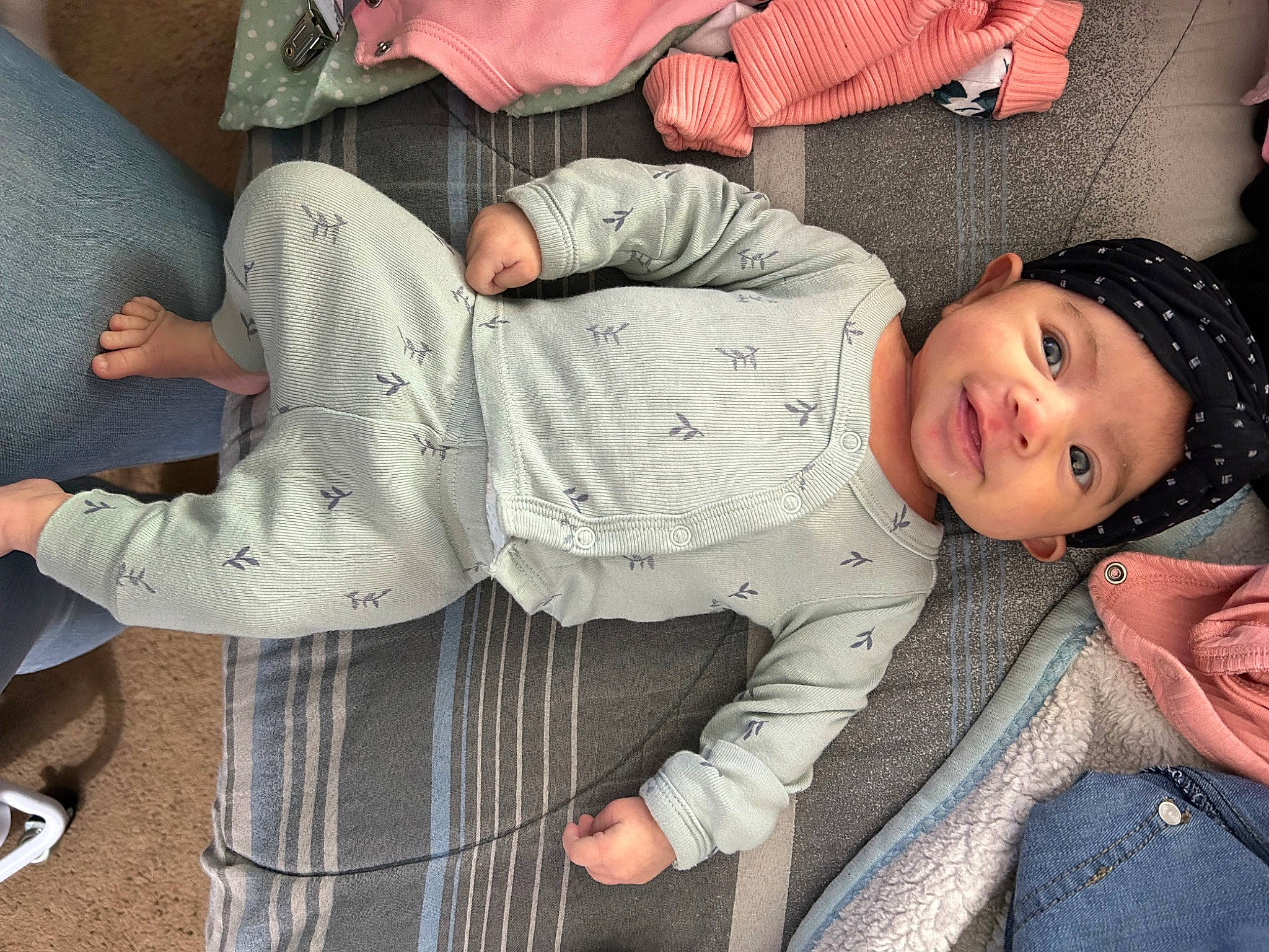 Frances joined the competition — help win amazing prizes! baby, baby_products, baby_toddler_clothing, child, comfort, cool, denim, fun, gesture, hat, headwear, human_leg, knee, lap, pattern, person, sitting, sleeve, smile, thigh