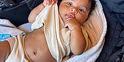Julian joined the competition — help win amazing prizes! baby, baby_clothes, blanket, child, clothing, comfort, curly_hair, cute, expression, face, hand, indoors, infant, knitwear, newborn, person, resting, skin, soft, stroller