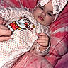 Ailannys joined the competition — help win amazing prizes! baby, bedding, blanket, bow, cartoon, child, close_up, face, hand, headband, hello_kitty, indoors, infant, lying_down, onesie, pink, polka_dots, portrait, serious_expression, soft_furnishings